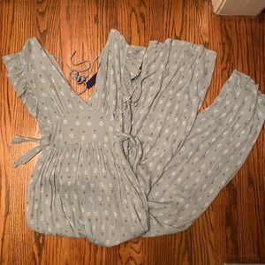 light blue jumpsuit with small yellow and white detail